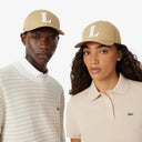 GORRA BEIGE CON BORDADO LACOSTE