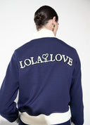 SUDADERA AZUL CON STRASS Y PERLAS EN ESPALDA LOLA CASADEMUNT
